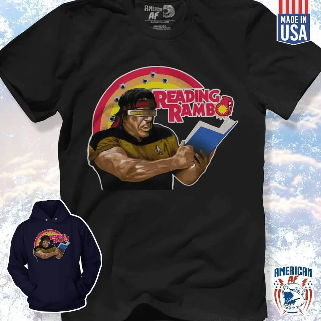 A black t-shirt and a navy blue hoodie display a graphic of a muscular man in a Starfleet uniform holding a book, with the…