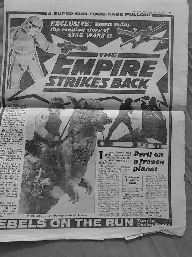 A black-and-white newspaper pullout from 'The Sun' dated April 23, 1980, advertising 'Star Wars II: The Empire Strikes…