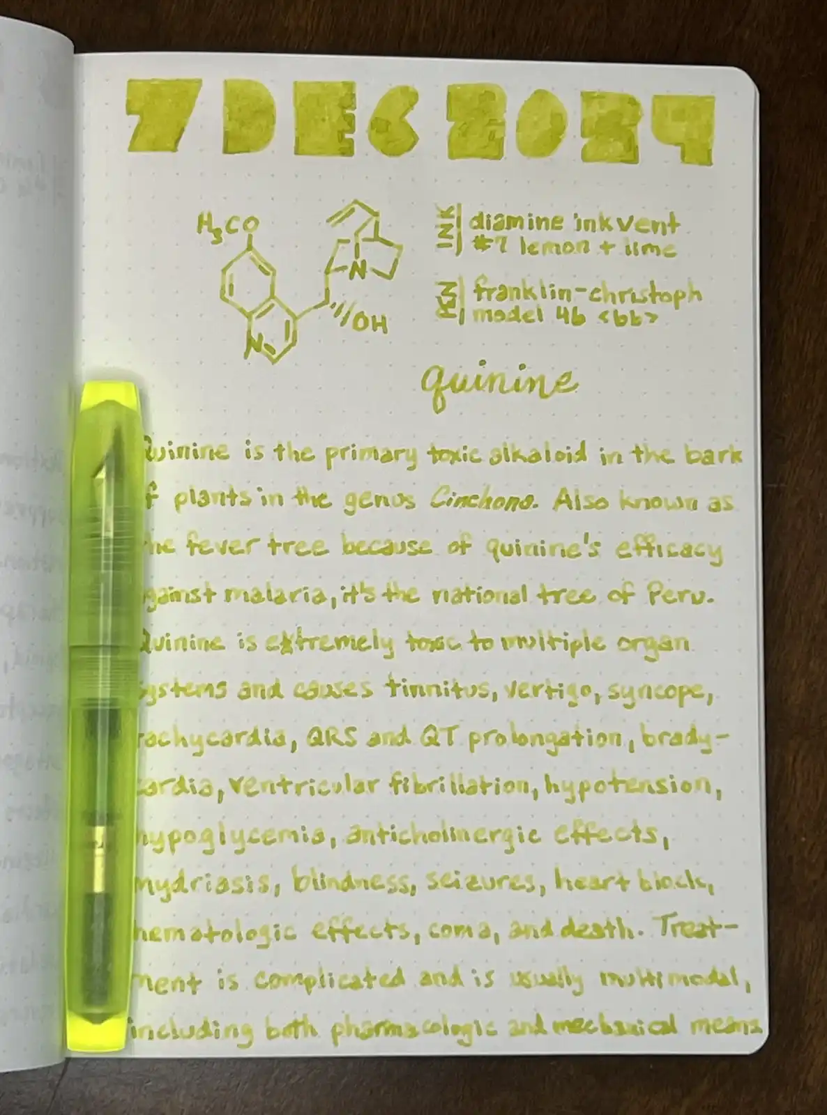 A close-up of a notebook page dated '7 DEC 2024' with handwritten text in yellow ink, detailing the chemical structure and…