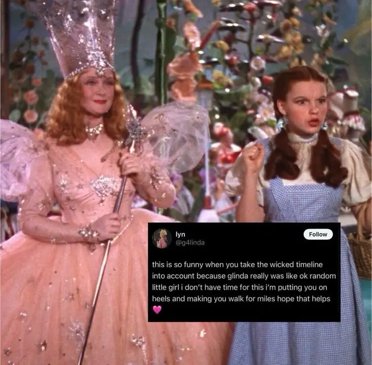 A still from 'The Wizard of Oz' shows Glinda the Good Witch in a pink gown holding a staff, standing beside Dorothy in her…