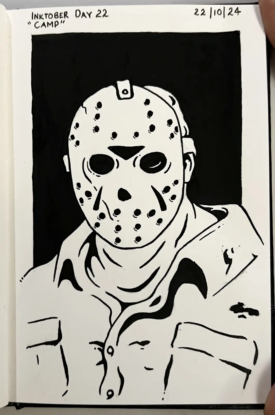 A black-and-white ink drawing in a sketchbook shows a person wearing a white hockey mask with holes, resembling Jason…