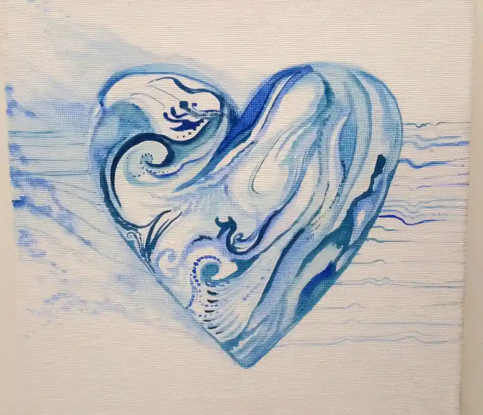 A hand-painted artwork on canvas depicts a stylized heart shape rendered in swirling blue and white brushstrokes, resembling…