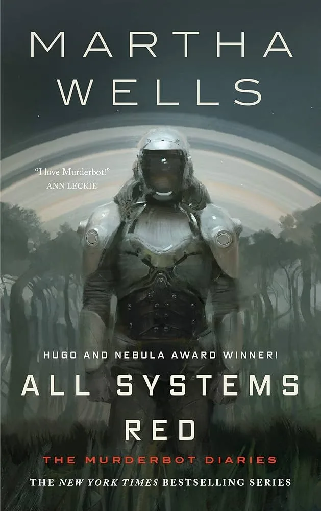 The image is the book cover for 'All Systems Red' by Martha Wells, featuring a humanoid robot in a silver armored suit…