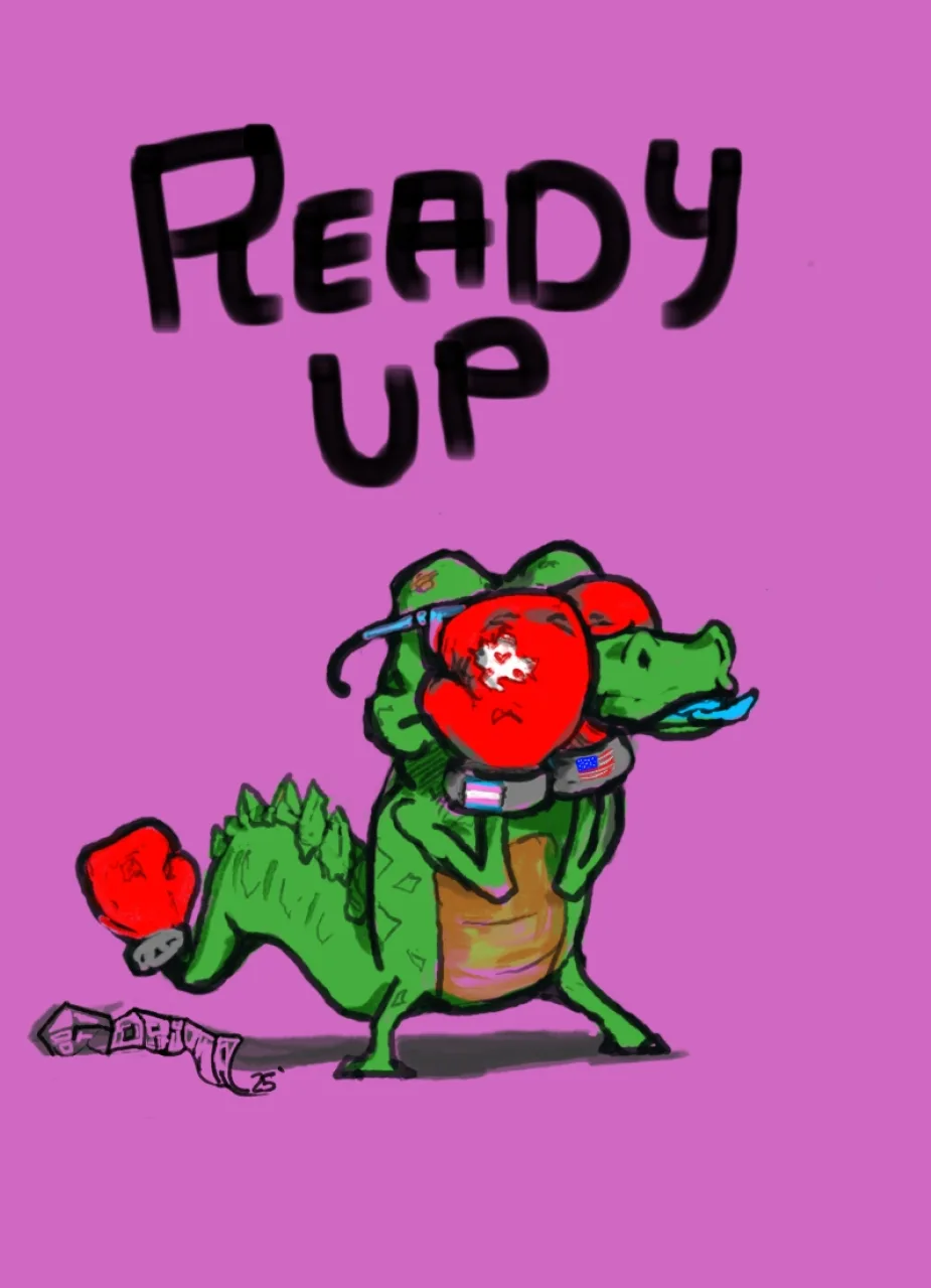 A cartoon green alligator wearing red boxing gloves and a grey belt with a small American flag and a transgender pride flag…