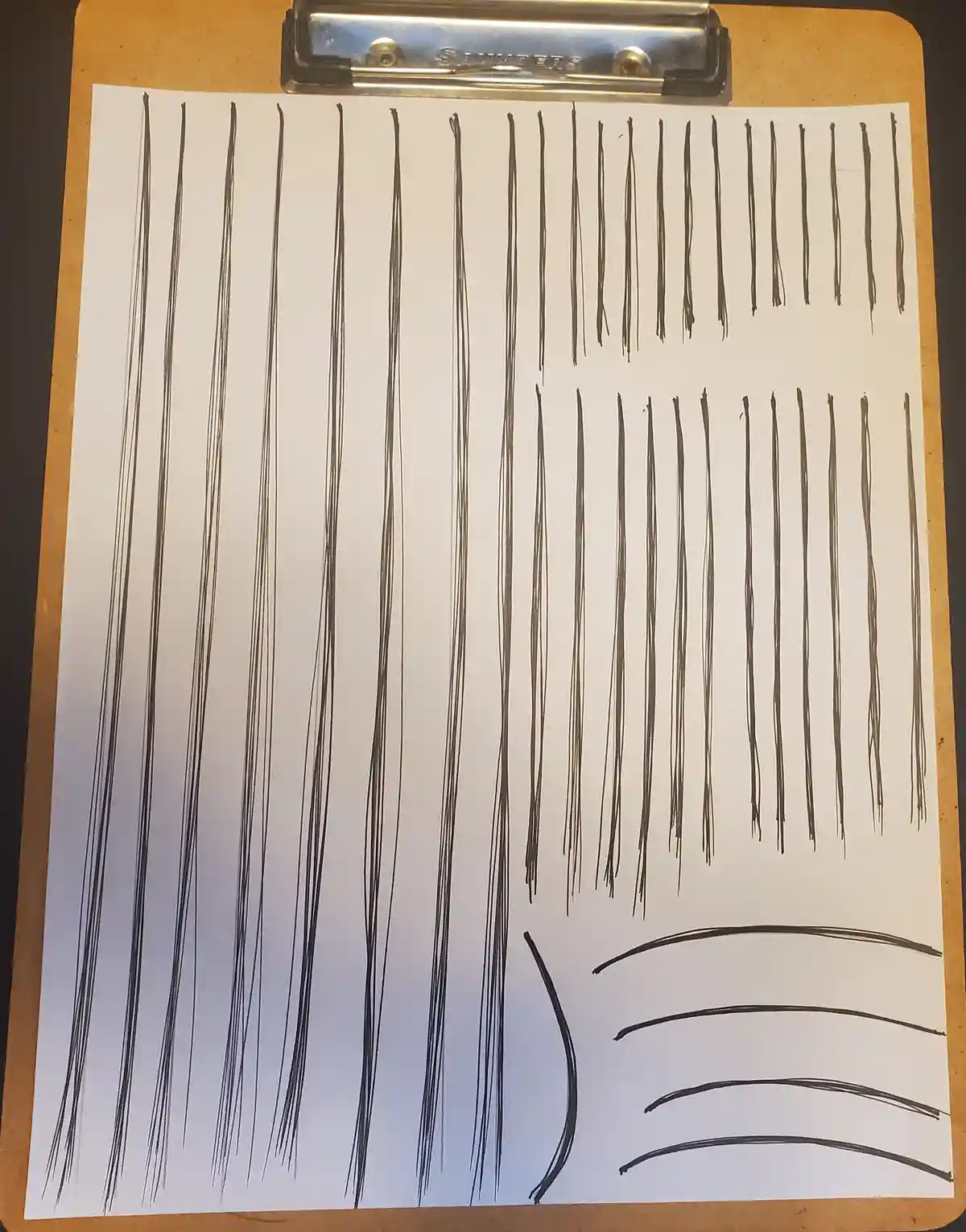 A white sheet of paper on a brown clipboard shows numerous attempts at drawing straight vertical lines, which are mostly…