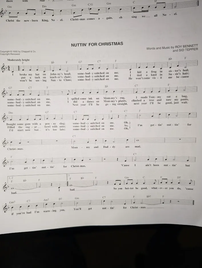 A close-up photo of a sheet music page for the song 'Nuttin' for Christmas' by Roy Bennett and Sid Tepper, showing the…