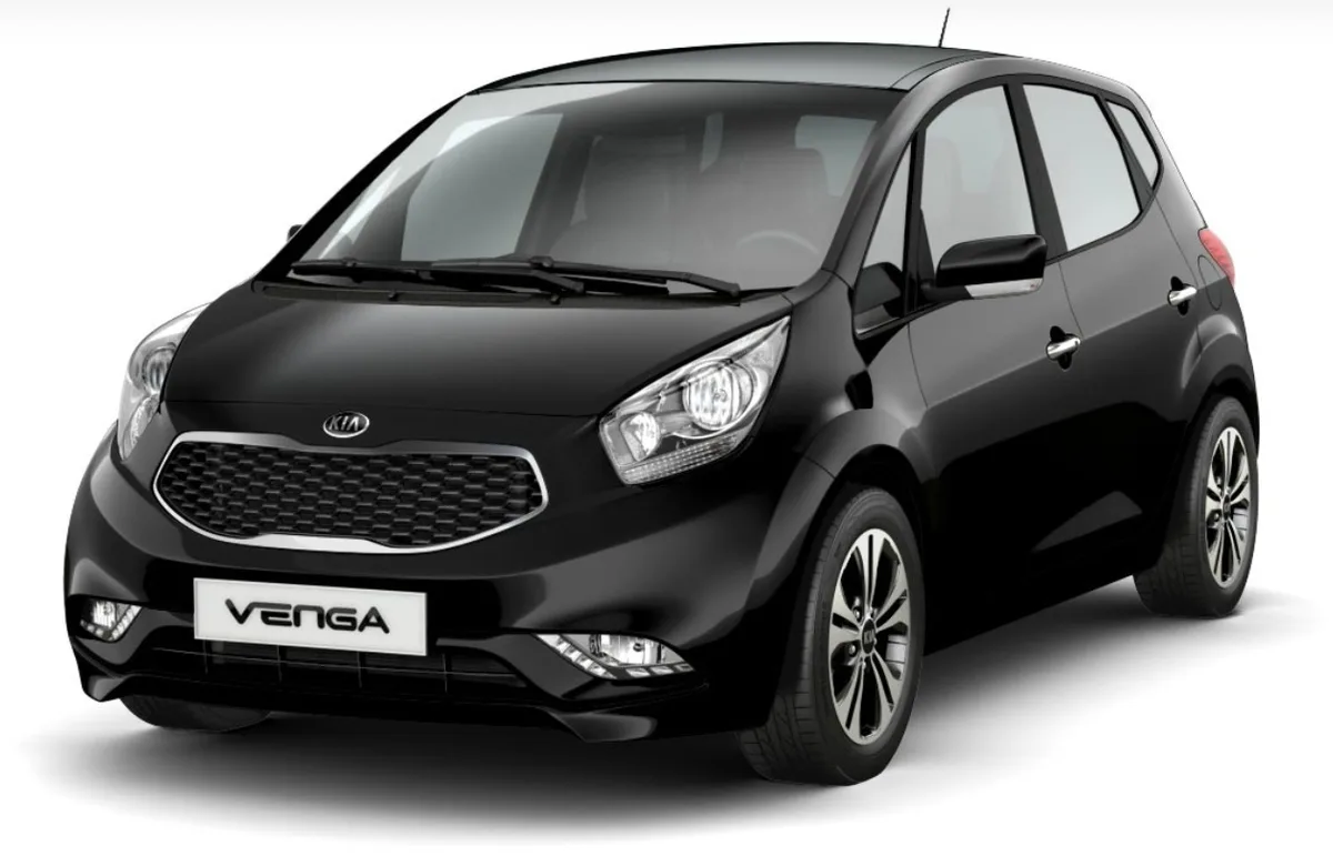A black Kia Venga compact car is shown in a studio shot against a white background. The car's front grille and badge are…
