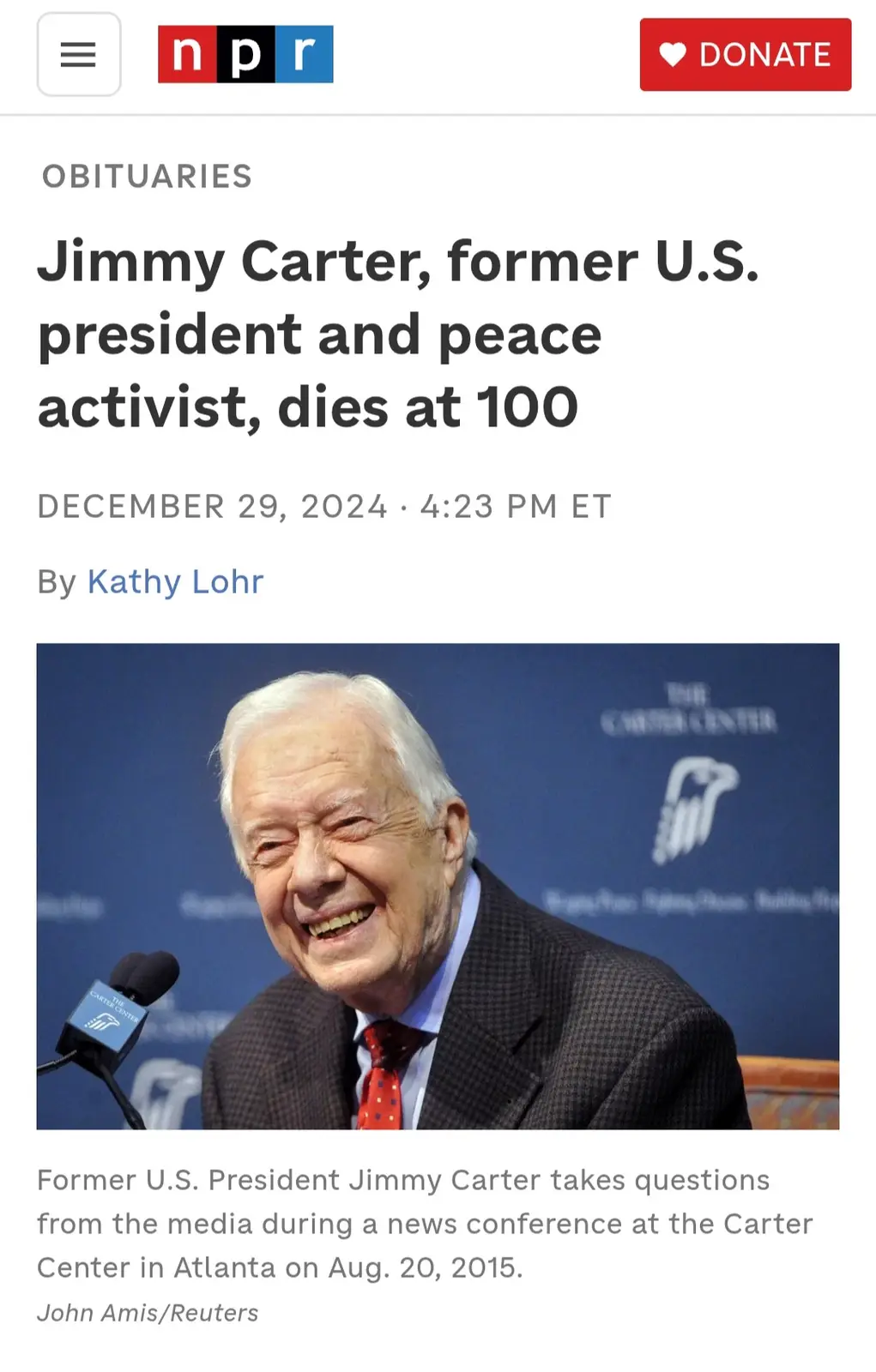 An NPR obituary screenshot shows a smiling Jimmy Carter at a 2015 news conference, with the headline announcing his death at…