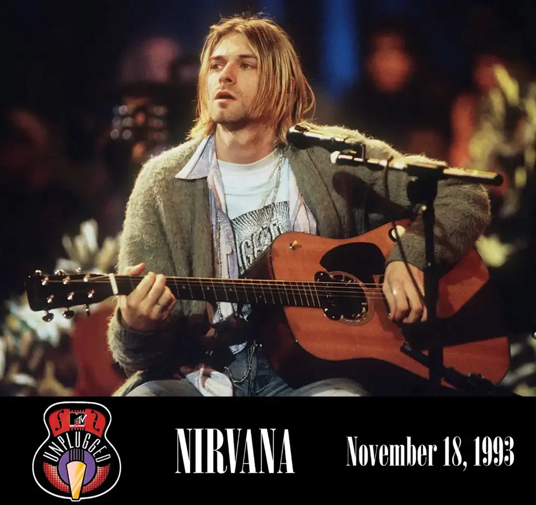 A still image of Kurt Cobain performing with an acoustic guitar during Nirvana's MTV Unplugged session on November 18, 1993…