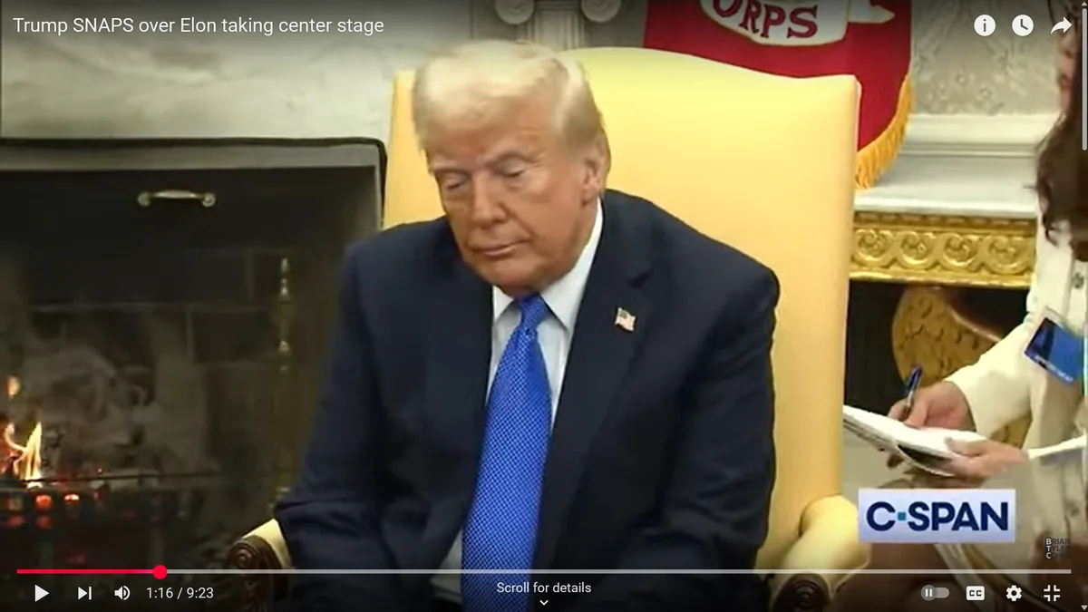 A still image from a C-SPAN video shows Donald Trump seated in a yellow chair, looking down with a displeased expression. He…