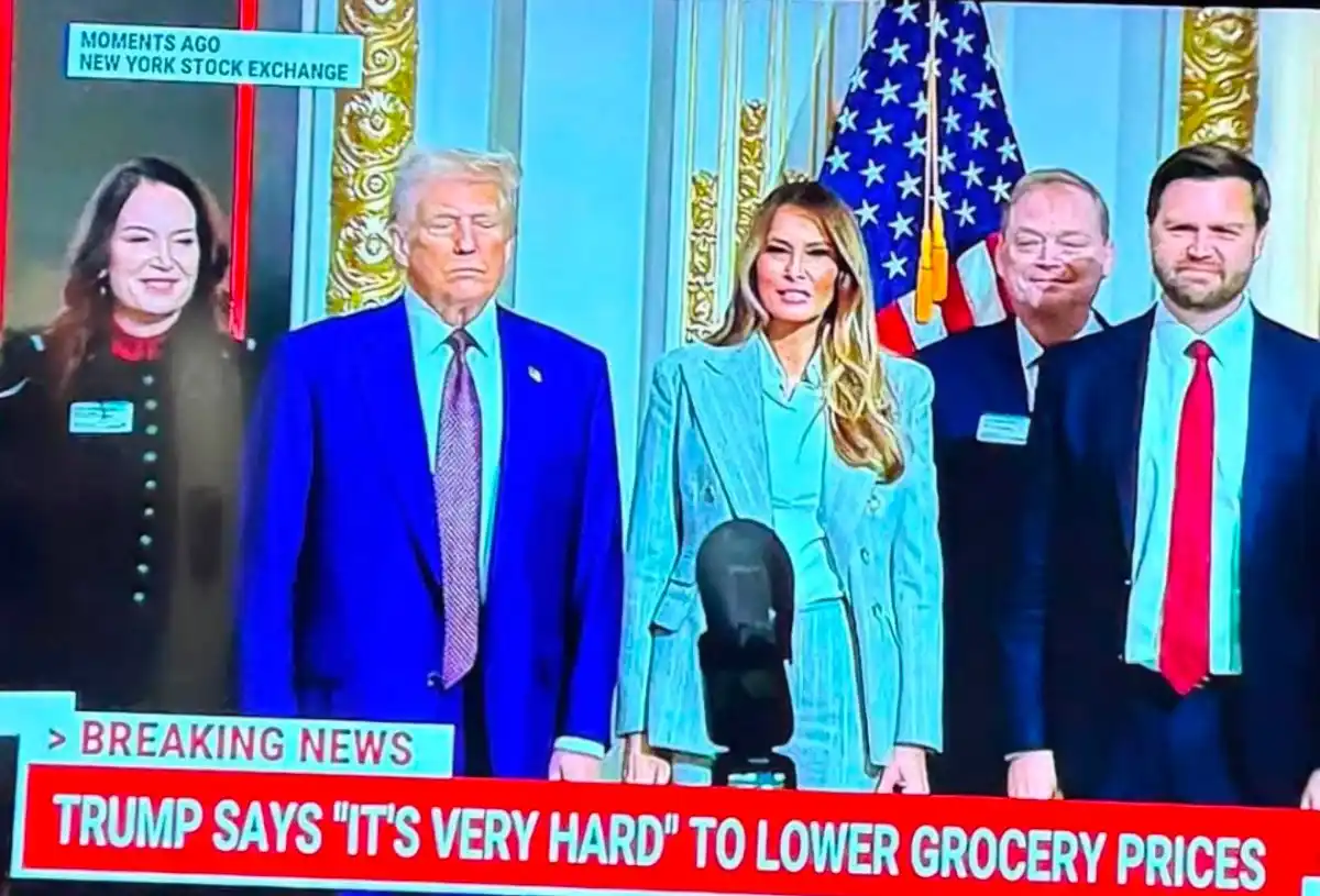 A news broadcast image shows Donald Trump, Melania Trump, and two men standing in front of an American flag. A breaking news…