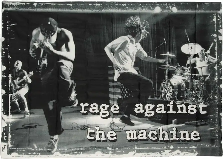 A black-and-white photo of the band Rage Against the Machine performing live on stage, with the band's name overlaid in…
