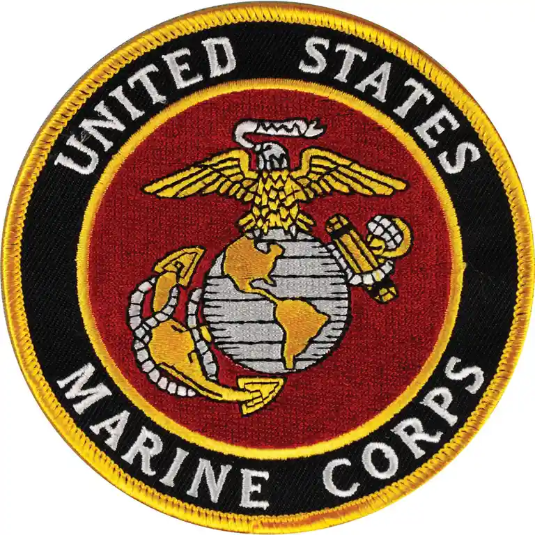 The image displays the official United States Marine Corps emblem, an embroidered circular patch with a red center, black…