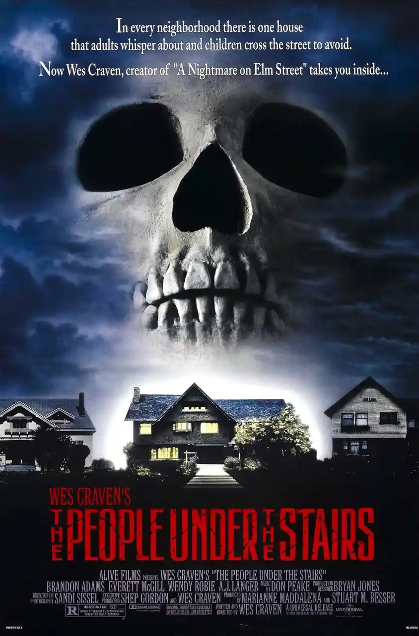 This is a movie poster for Wes Craven's 1991 horror film 'The People Under the Stairs'. It features a large, ominous skull…