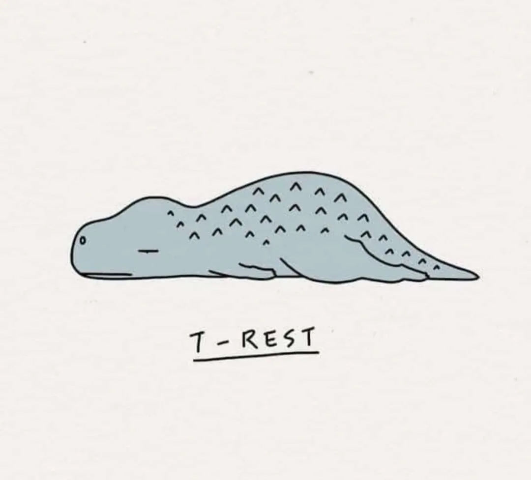 A simple cartoon drawing of a light blue, reptilian creature lying flat on its stomach with closed eyes, appearing to be…
