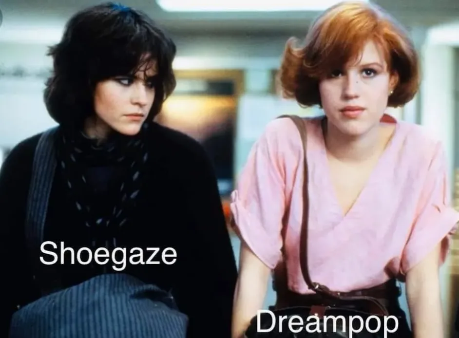 Two women from a 1980s film scene are labeled with music genres. The woman on the left, wearing a dark scarf and looking…