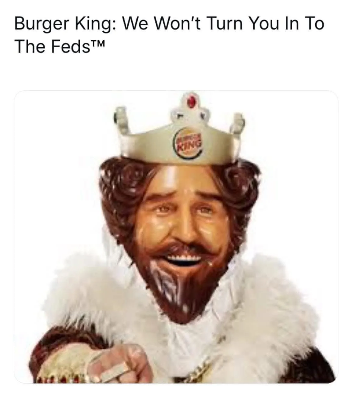 A smiling, bearded man in royal attire, including a crown with the Burger King logo and a white fur collar, points forward…