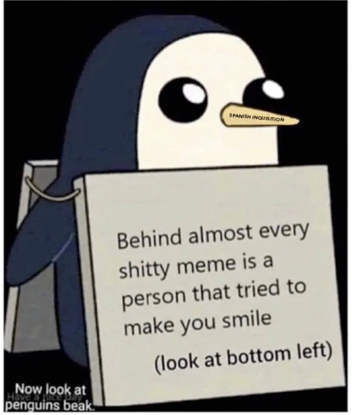 A cartoon penguin with a dark blue body and white face holds a sign that reads 'Behind almost every shitty meme is a person…
