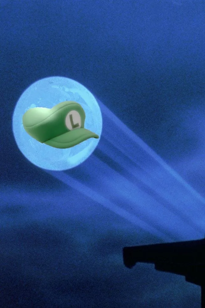 A green Luigi hat with a white 'L' emblem is superimposed over a full moon in a dark blue night sky, with beams of light…