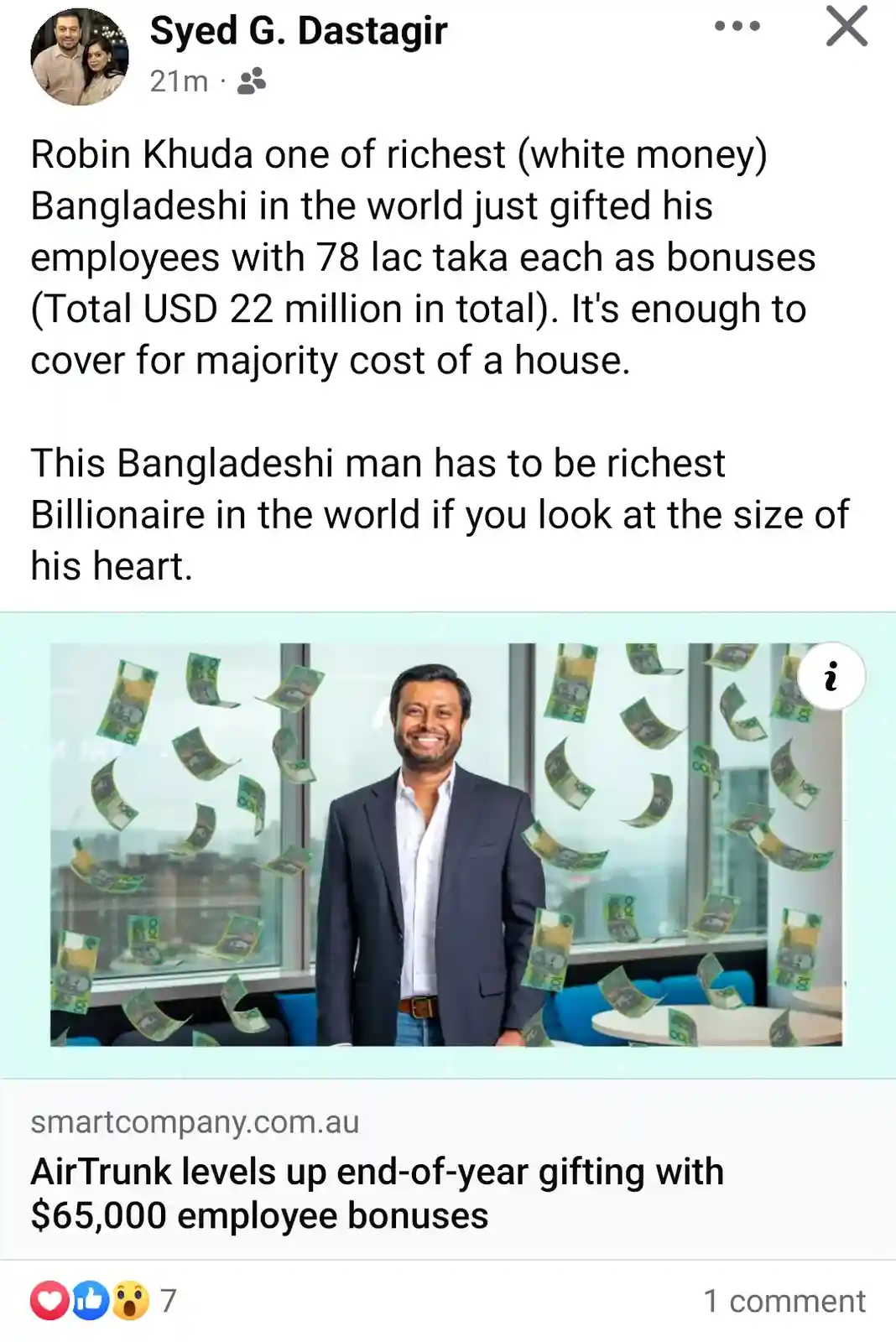A man in a dark suit and white shirt stands smiling in an office with large windows, surrounded by falling Australian $100…