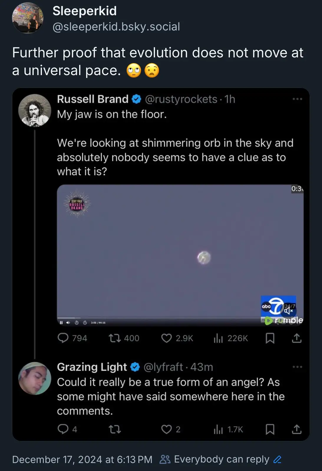 A screenshot of a social media post by 'Sleeperkid' sharing a tweet from Russell Brand. The tweet includes a video of a…