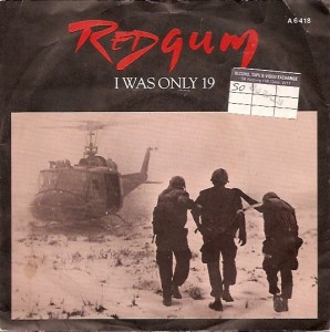 A sepia-toned image of three soldiers walking away from a helicopter in a desert-like terrain, overlaid with the red text…