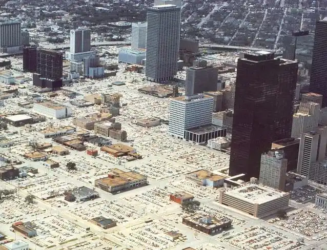 An aerial photo of a cityscape with numerous skyscrapers and low-rise buildings, but the vast majority of the ground area is…