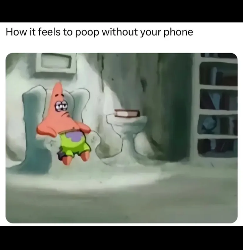 Patrick Star from SpongeBob SquarePants sits in a bathroom, looking bored and unamused, with a book on the toilet tank…