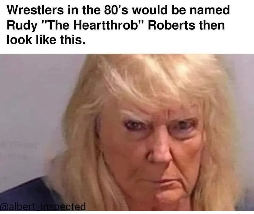 The image shows a close-up of an older woman with long, straight blonde hair, heavy makeup, and a stern, unamused facial…