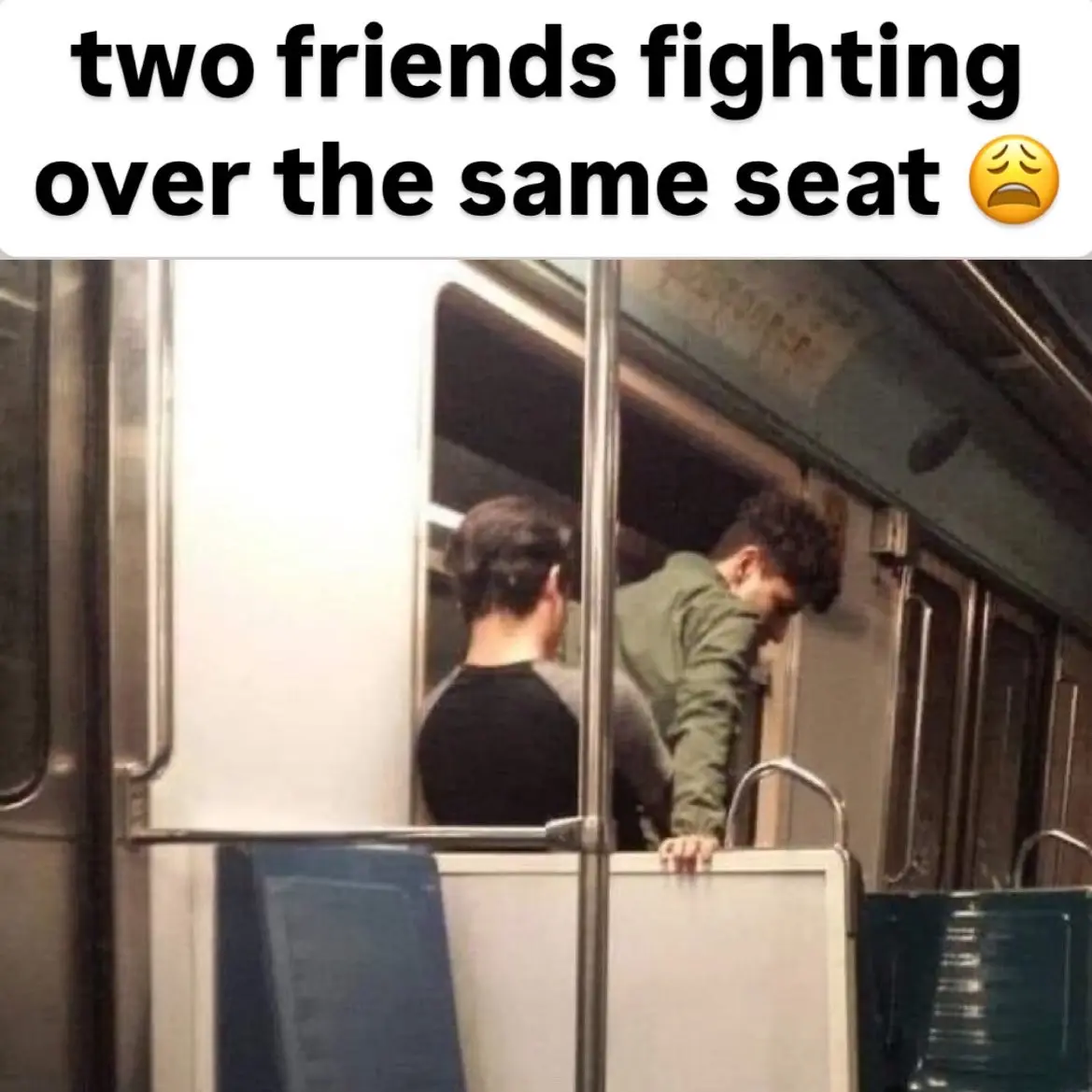 Two men are seen inside a subway car, one in a black shirt and another in a green jacket, both leaning over a metal pole…
