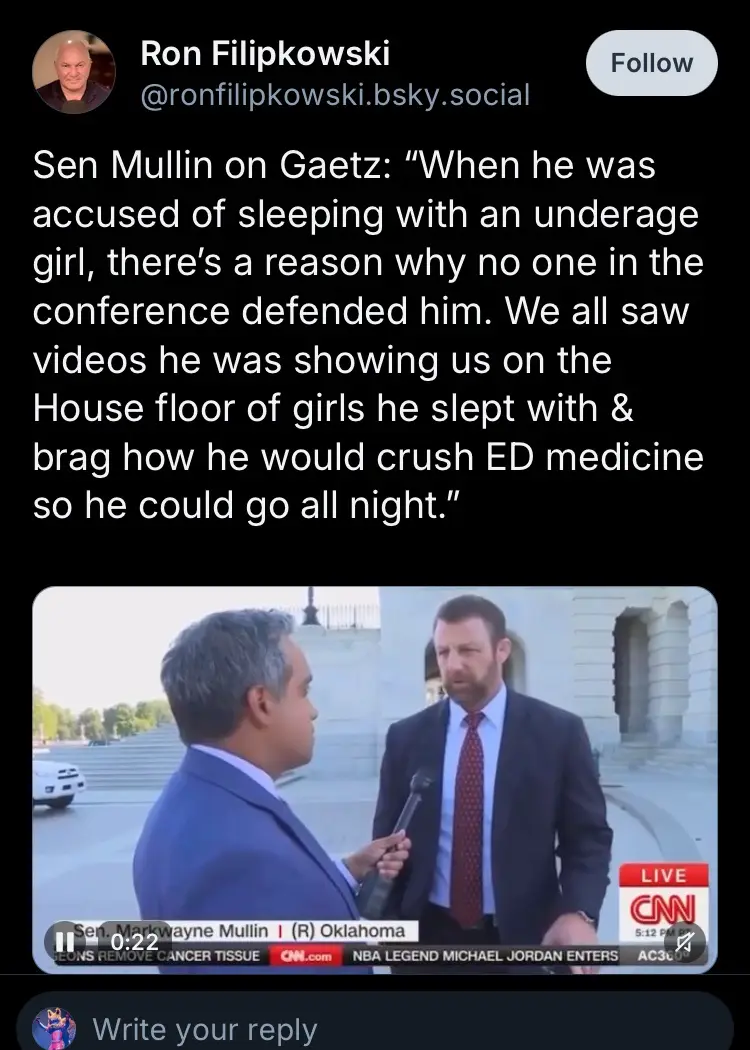 A screenshot of a CNN live interview shows Senator Markwayne Mullin in a suit being asked a question by a reporter. The…