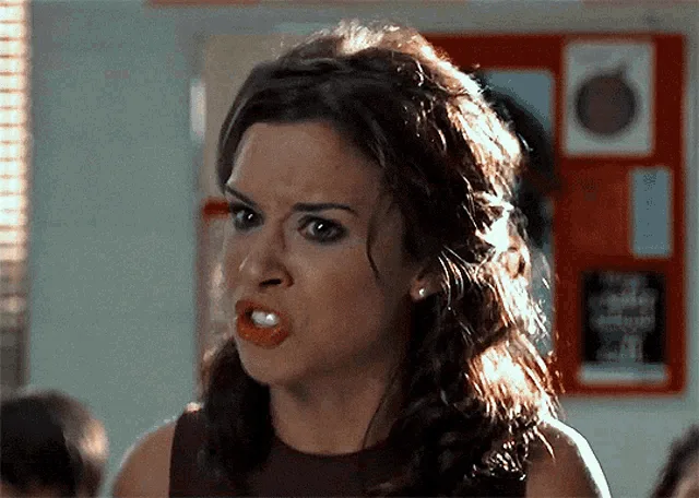 A six-panel image sequence shows a woman with dark hair and orange lipstick in escalating expressions of rage, then shock…