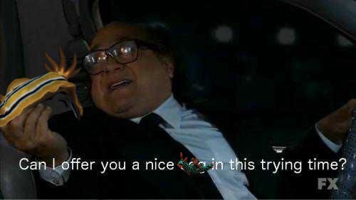A man in a suit and glasses sits in a car at night, holding a yellow and black striped snake. The overlaid text reads 'Can I…