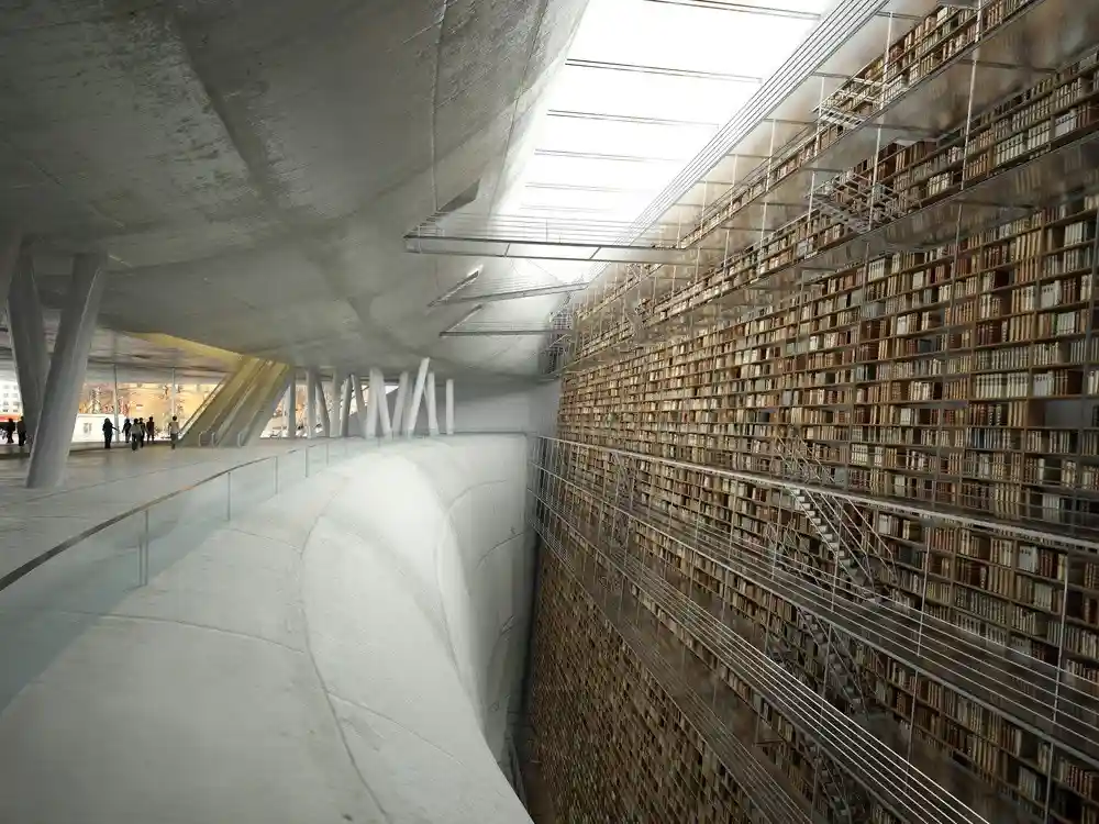 An architectural rendering of a modern library with a curved concrete walkway and a towering wall of bookshelves filled with…
