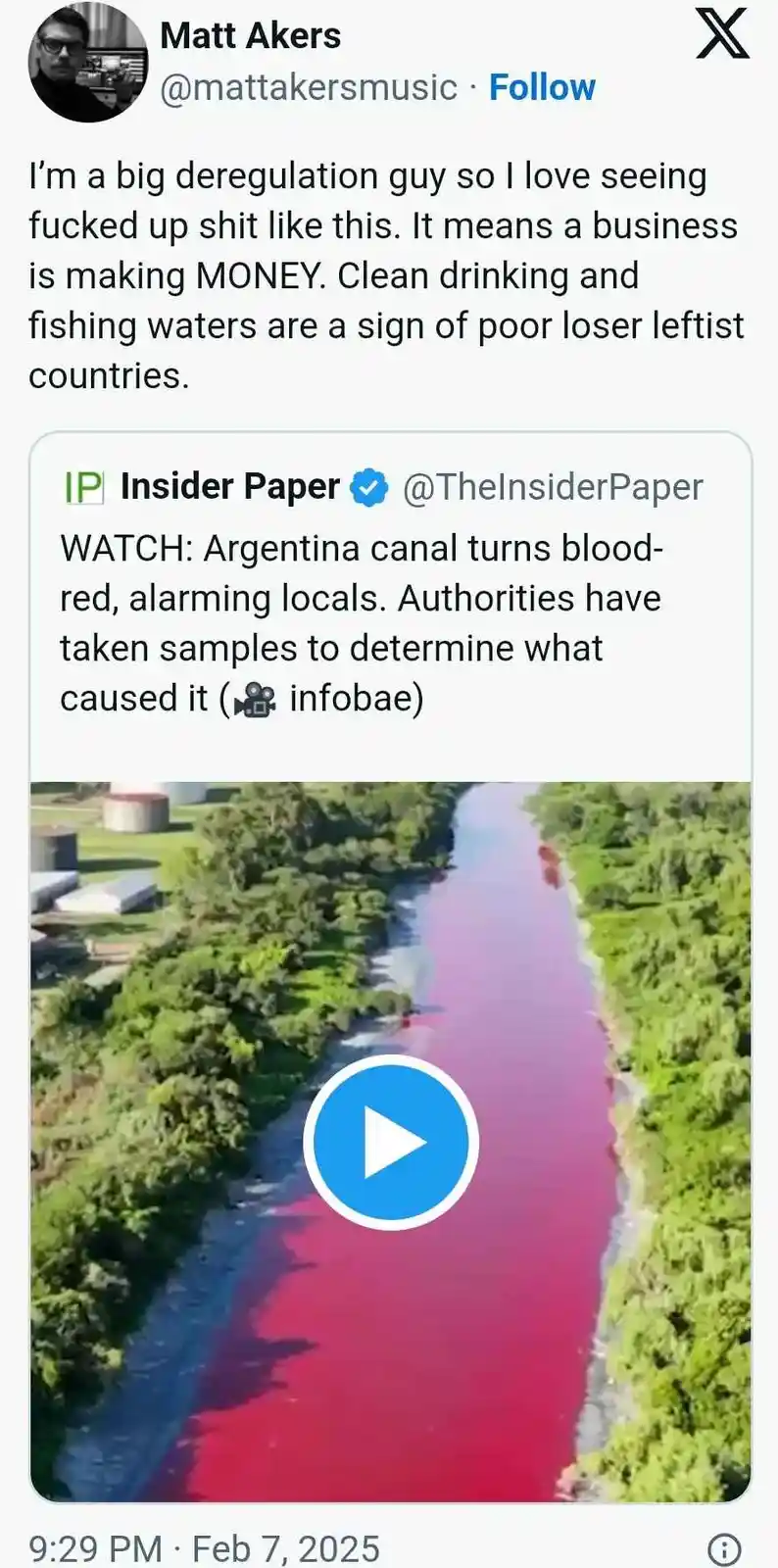 An aerial view of a canal with a distinct red and blue coloration, flanked by green vegetation. Overlaid text from a tweet…