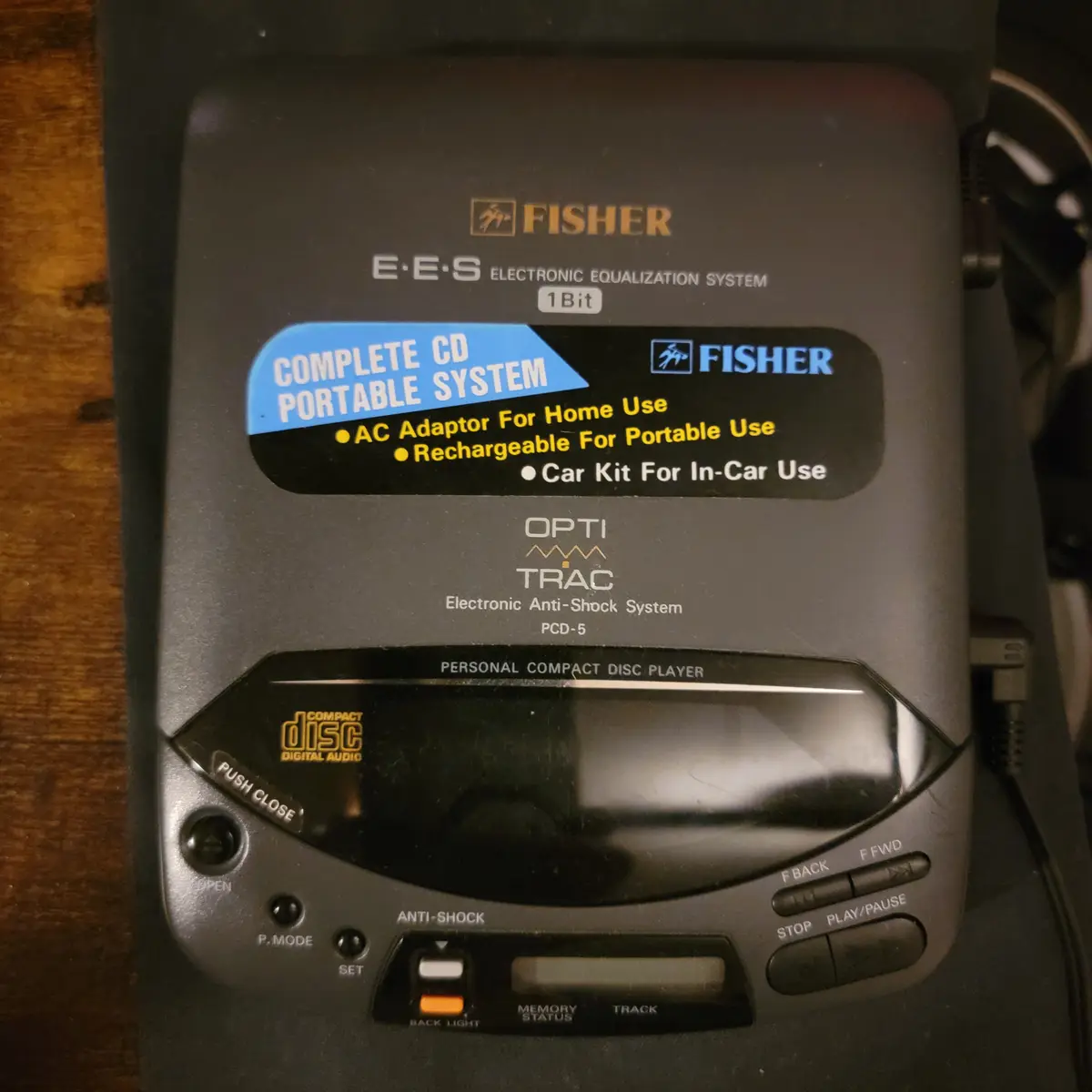 A close-up photo of a Fisher brand portable CD player, model PCD-5, with a sticker advertising it as a 'COMPLETE CD PORTABLE…