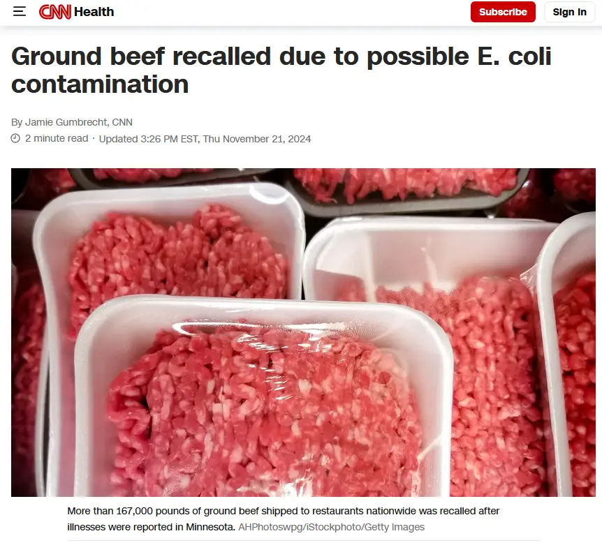 A close-up photo shows multiple white plastic containers filled with raw ground beef, each sealed with clear plastic wrap…