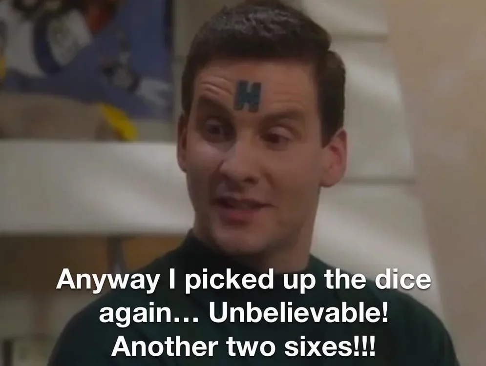 A man with a large 'H' tattoo on his forehead looks excited and slightly dazed, wearing a dark green shirt. The overlaid…