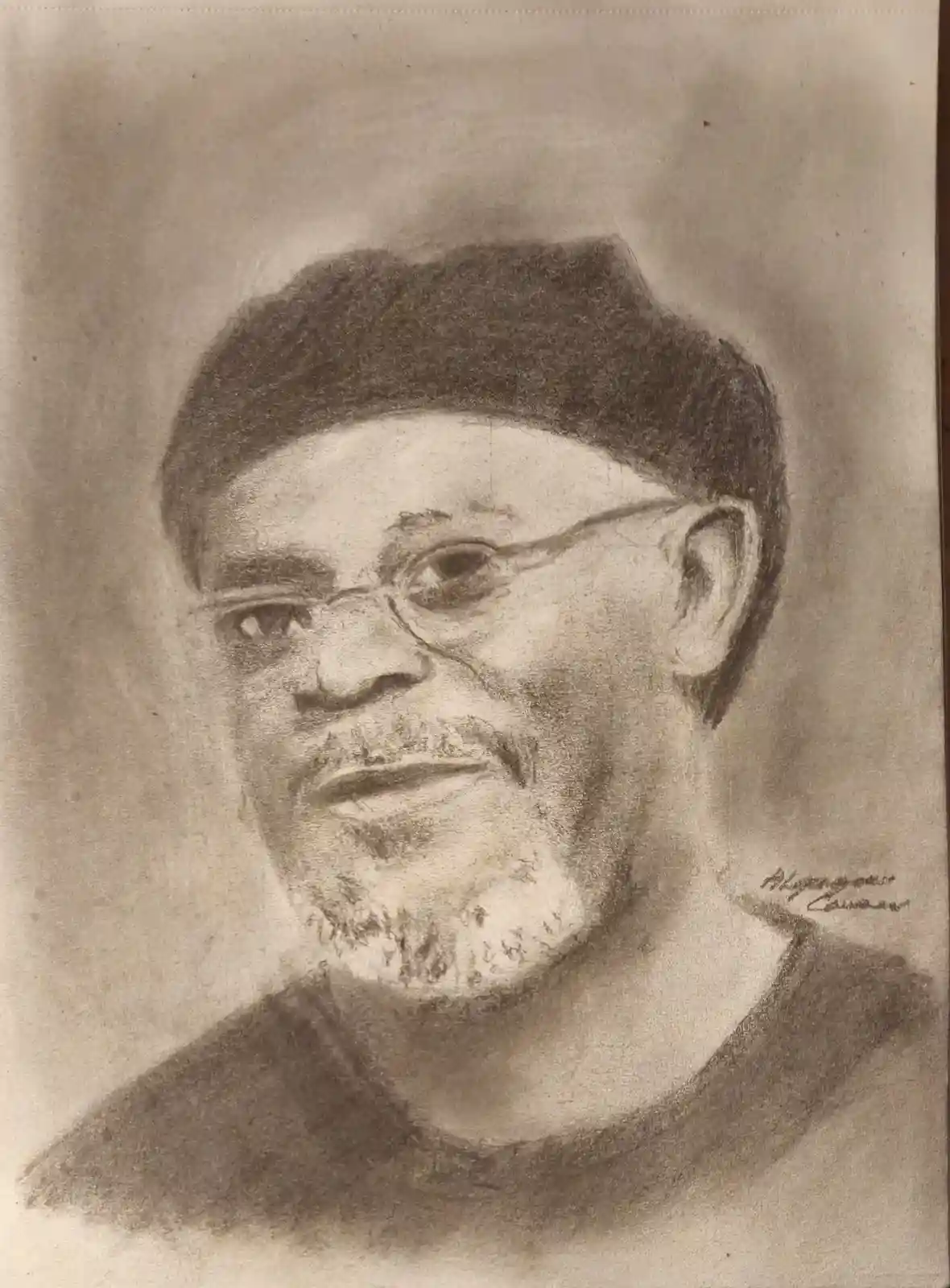 A charcoal sketch of a man with glasses and a head covering, looking slightly to the side with a neutral expression. The…