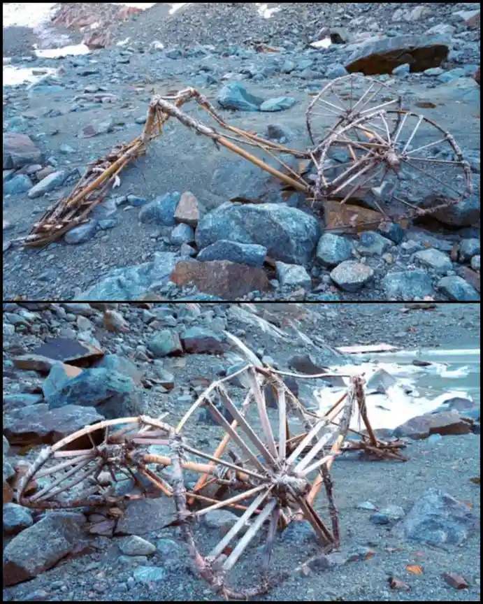 The image shows two photos of a broken, rusted, wooden-framed vehicle with large spoked wheels lying on a rocky, gravelly…