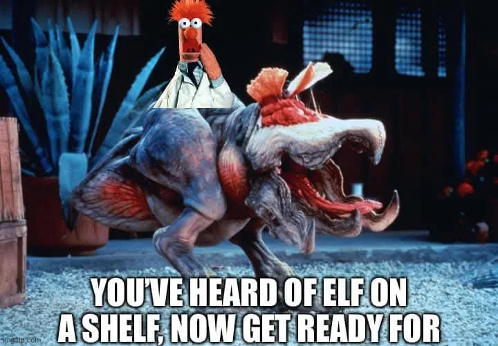 A still image from a movie shows a large, monstrous, reptilian creature with a wide-open mouth and sharp teeth. Perched on…