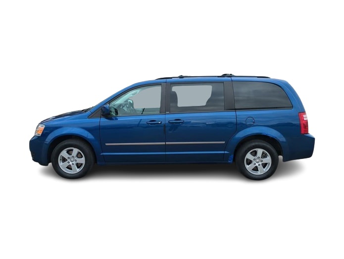 A blue minivan is shown in profile against a white background. Overlaid text reads 'i'm not lazy, i'm just conserving…