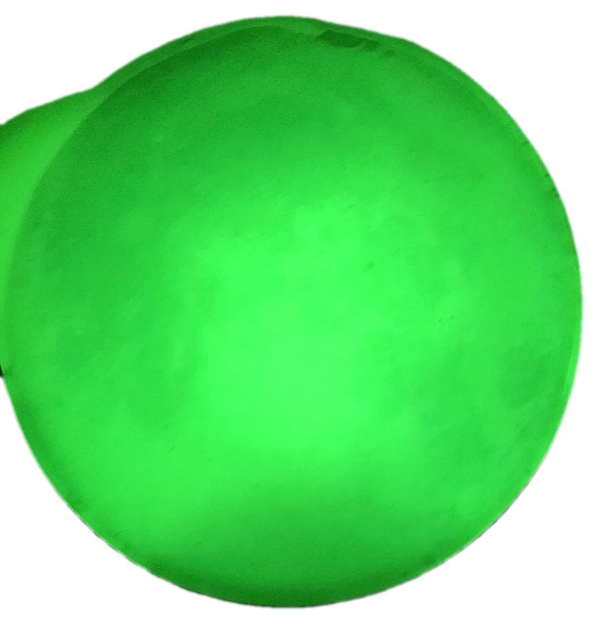 A close-up image shows a large, round, glowing green orb against a black background, with the overlaid text 'i'm not a fan…