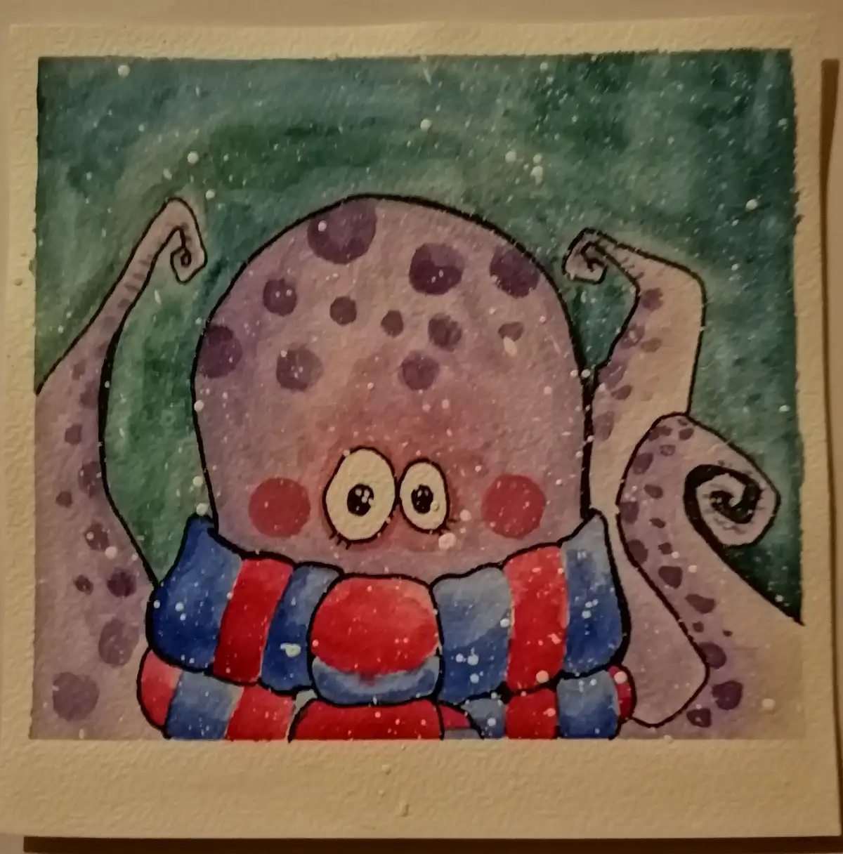 A watercolor drawing of a cute, round, purple-spotted cartoon squid with large eyes and red cheeks, wearing a red and blue…
