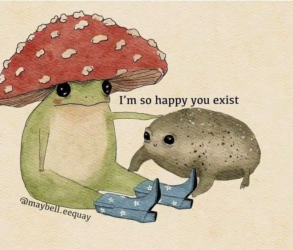 A watercolor illustration shows a green frog wearing a red mushroom cap, gently holding a small, spotted, potato-like…