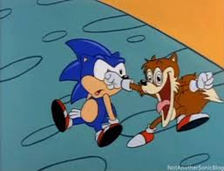 In a cartoon scene, Sonic the Hedgehog is being punched in the face by his friend Tails, who is yelling with an exaggerated…