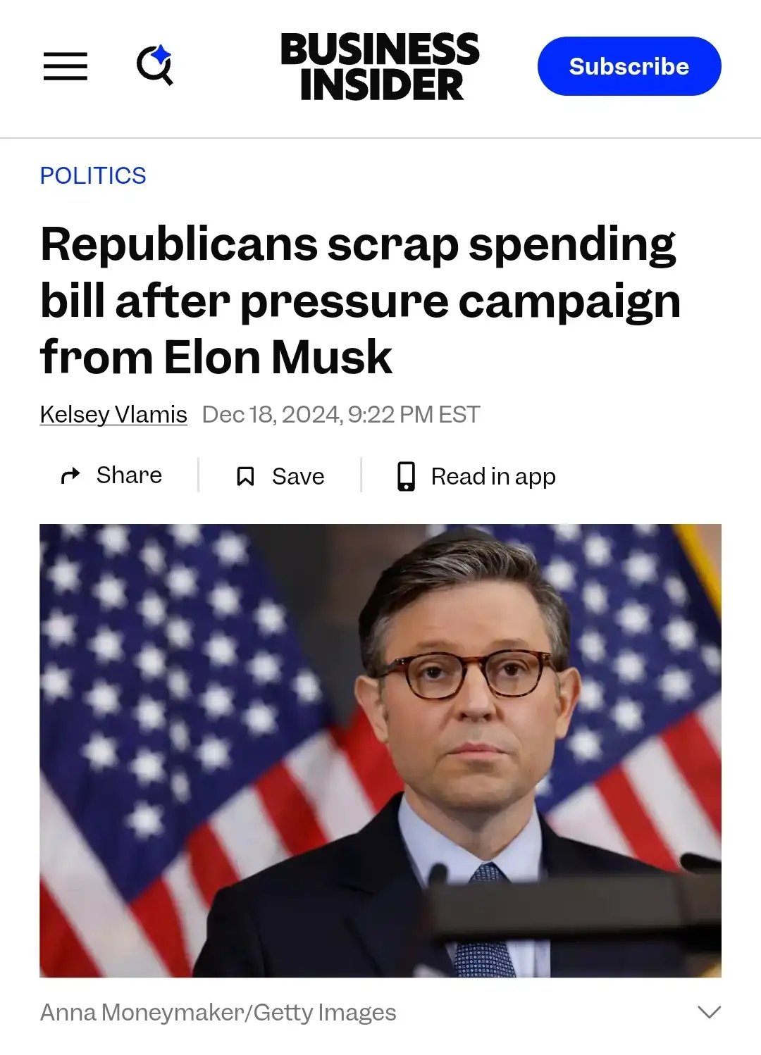 A screenshot of a Business Insider article headline showing a man in a suit and glasses standing at a podium with American…