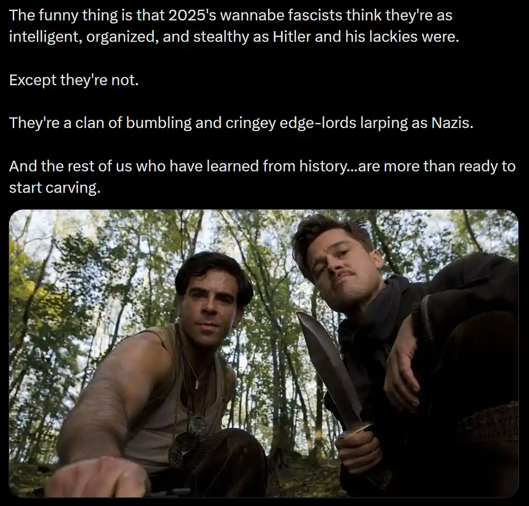 Two men in a forest, one holding a large knife, looking down at the camera with serious expressions. The text overlaid on…
