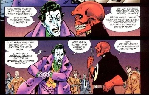 A comic book panel featuring the Joker and the Red Skull in a two-part scene. In the top panel, the Joker, in his purple…
