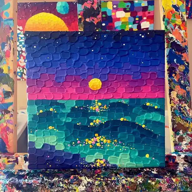A textured, thickly painted canvas depicts a stylized sunset with a yellow sun over a gradient sky of blue, purple, and…